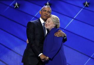 Democratic Presidential nominee Hillary Clinton hugs President Barack Obama after joining him on stage during the third day of the Democratic National Convention in Philadelphia , Wednesday, July 27, 2016. (AP Photo/J. Scott Applewhite)