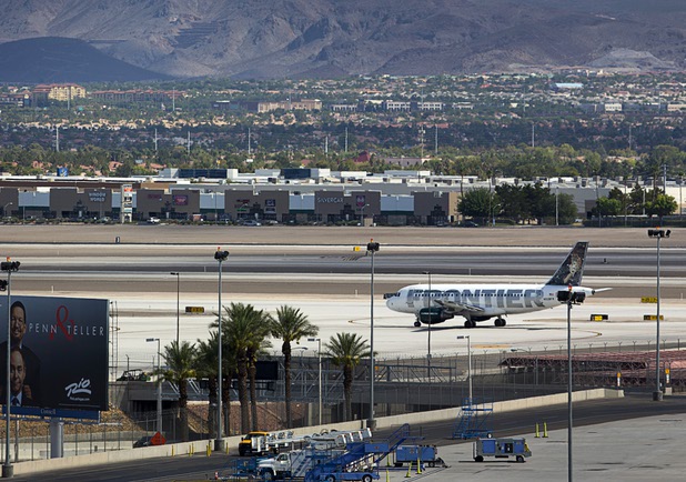A Frontier passenger jet taxies to a runway at McCarran International Airport Tuesday, August 2, 2016.