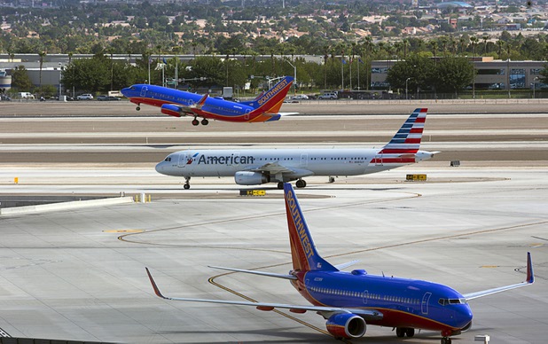 An American Airlines passenger jet heads to a gate after landing at McCarran International Airport Tuesday, August 2, 2016.
