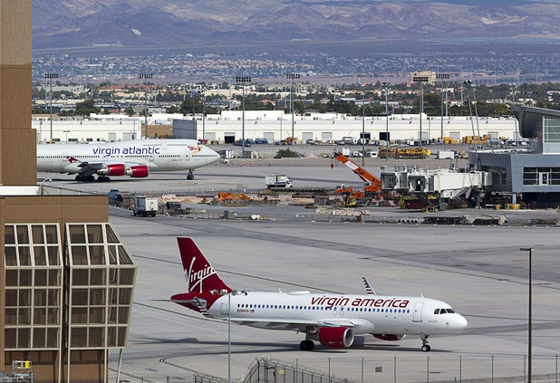 A Virgin America passenger jet taxis to a runway at McCarran International Airport Tuesday, August 2, 2016.