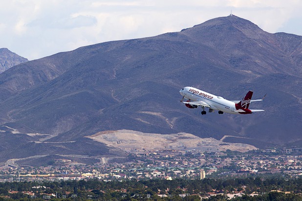 A Virgin America passenger jet takes off from McCarran International Airport Tuesday, August 2, 2016.