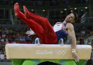 United States' Chris Brooks stumbles on the pommel horse during the artistic gymnastics men's qualification at the 2016 Summer Olympics in Rio de Janeiro, Brazil, Saturday, Aug. 6, 2016. (AP Photo/Rebecca Blackwell)