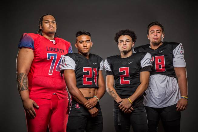 Members of the Liberty High football team pose for a photo at the Las Vegas Sun's high school football media day July 20, 2016 at the South Point. They include, from left, Malaesala Aumavae-Laulu, Darion Acohido, Ethan Dedeaux, and Will Brewer.