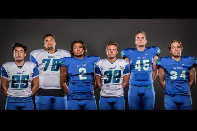 Members of the Green Valley High football team pose for a photo at the Las Vegas Sun's high school football media day July 20, 2016 at the South Point. They include, from left, Christian Mayberry, Eric Brown, C.J. Araujo, Braxton Harms, Brock Hershberger, and Eric Faber.