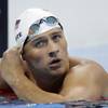 United States' Ryan Lochte checks his time in a men's 4x200-meter freestyle heat during the swimming competitions at the 2016 Summer Olympics, Tuesday, Aug. 9, 2016, in Rio de Janeiro, Brazil.