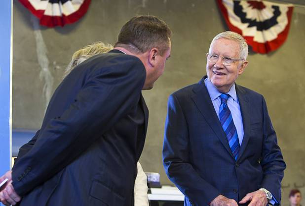Senate Minority Leader Harry Reid (D-Nev.) listens to Marc Biagiotti, president of SDA, Inc., during an opening ceremony for the Federal Justice Tower, a new office building in downtown Las Vegas, Thursday, Aug. 18, 2016. The building will provide office space for multiple components of U.S. Immigration and Customs Enforcement, the U.S. Attorneys Office for the District of Nevada, the Federal Protective Service and the Department of Labors Office of the Inspector General.