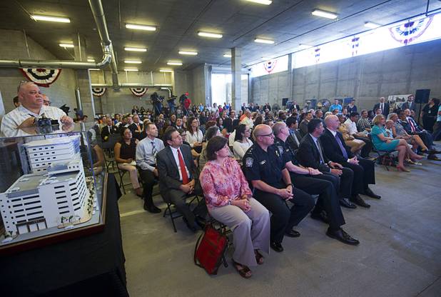 Guests listen to speakers during an opening ceremony for the Federal Justice Tower, a new office building in downtown Las Vegas, Thursday, Aug. 18, 2016. The building will provide office space for multiple components of U.S. Immigration and Customs Enforcement, the U.S. Attorneys Office for the District of Nevada, the Federal Protective Service and the Department of Labors Office of the Inspector General.