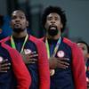 Members of the United States' men's basketball team stand for the national anthem Sunday, Aug. 21, 2016, after accepting their gold medals at the the 2016 Summer Olympics in Rio de Janeiro.