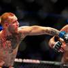 Welterweight Conor McGregor connects again on the chin of Nate Diaz during their UFC 202 fight night action at the T-Mobile Arena on Saturday, August 20, 2016.