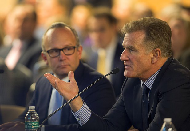 Andy Abboud, left, senior vice president of Government Relations and Community Development for the Venetian and the Las Vegas Sands, listens as Rob Goldstein, president/COO of Las Vegas Sands, addresses the Southern Nevada Tourism Infrastructure Committee at UNLV Thursday, Aug. 25, 2016.