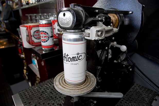An Atomic-themed beer "crowler" is shown on a canning machine at Atomic Liquors, 917 Fremont St., in downtown Las Vegas Sunday, Aug. 28, 2016.