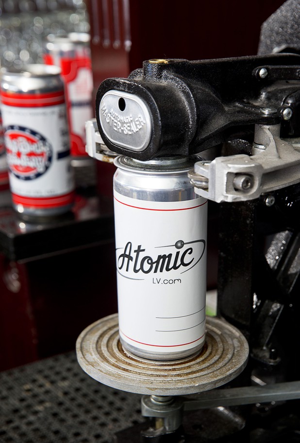 An Atomic-themed beer "crowler" is shown on a canning machine at Atomic Liquors, 917 Fremont St., in downtown Las Vegas Sunday, Aug. 28, 2016.