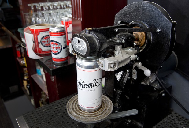 An Atomic-themed beer "crowler" is shown on a canning machine at Atomic Liquors, 917 Fremont St., in downtown Las Vegas Sunday, Aug. 28, 2016.
