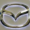 This Feb. 14, 2013, file photo, shows the Mazda logo on a sign at the 2013 Pittsburgh Auto Show, in Pittsburgh.