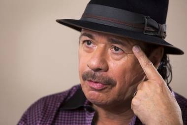 Musician Carlos Santana responds to a question during an interview at his office in Las Vegas Tuesday, Sept. 13, 2016.