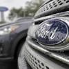 In this Jan. 12, 2015, file photo, Ford vehicles sit on the lot at a car dealership, in Brandon, Fla.