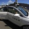 A journalist gets in a self-driving Uber for a ride during a media preview at Uber's Advanced Technologies Center in Pittsburgh Monday, Sept. 12, 2016.