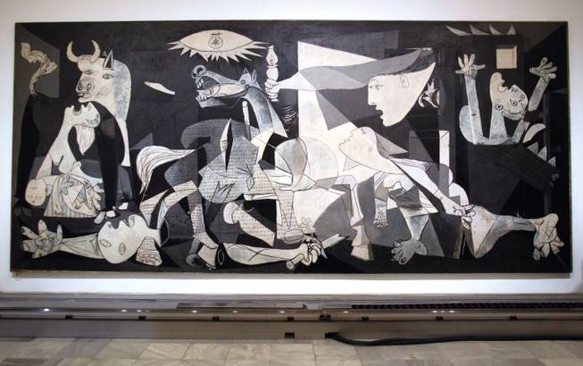 This  Tuesday Feb. 21, 2012 photo of Pablo Picasso's 'Guernica' painting is seen displayed at the Reina Sofia Museum in Madrid. 