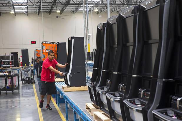 A worker moves a slot machine in the assembly area of the new 291,000 square-foot headquarters of Ainsworth North America on Sept. 22. Ainsworth North America is the U.S. division of Australian slot manufacturer Ainsworth Game Technology.
