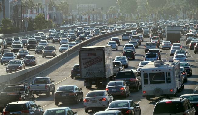 Rush-hour traffic moves along the Hollywood Freeway in Los Angeles on Sept. 9, 2016. California's traffic-locked roads are being considered for their potential to serve a new purpose as clear power producers. After several years studying the technology, the California Energy Commission is soliciting companies and universities to create small-scale field tests to investigate whether the waste energy created by vehicles, and passed onto roads when driving, could be captured and turned into electricity.