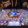 A woman plays a "Brew Caps" game at the Gamblit booth during the Global Gaming Expo (G2E) convention at the Sands Expo and Convention Center Tuesday, Sept. 27, 2016. The Nevada Gaming Commission on Thursday will consider changes to speed up the development of new games.
