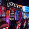 People look over "The Voice"-themed slot machines at the IGT booth during the Global Gaming Expo (G2E) convention at the Sands Expo and Convention Center Tuesday, Sept. 27, 2016.