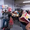 Customers make their way through the crowd with microwaves during the grand opening of Curacao home electronics deparment store at Meadows Mall, Saturday, Oct. 1, 2016. As Part of the grand opening, Curacao offered the first 100 customers a Sunbeam microwave for $12.