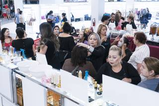 Beauty consultants apply facial products to customers during the grand opening of Curacao home electronics deparment store at Meadows Mall, Saturday, Oct. 1, 2016