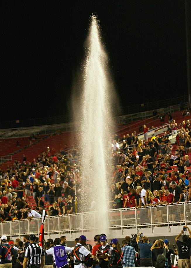 A water valve burst sends a plume into the air for a minute late in the UNLV and Fresno State game at Sam Boyd Stadium in Las Vegas on Saturday, Oct. 1, 2016.