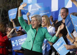 Sen. Elizabeth Warren, D-Mass., attends a rally, Tuesday, Oct. 4, 2016, in Las Vegas. The rally was held to support Democratic presidential candidate Hillary Clinton. (AP Photo/John Locher)