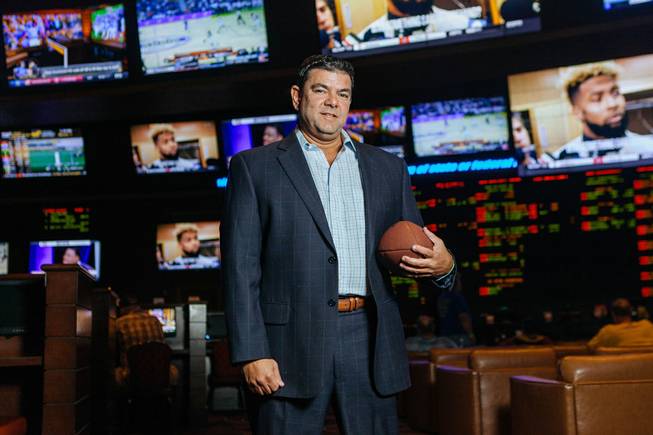 Chuck Esposito, the Race & Sports Book Director for Sunset Station Casino poses for a photo inside the Sports book at Sunset Station on October 5, 2016. 