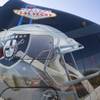 A truck decorated with a Raiders helmet and "Welcome to Las Vegas" sign is displayed before a bill signing ceremony at UNLV Monday, Oct. 17, 2016.  Senate Bill 1 will increase hotel room tax to help finance a $1.9 billion stadium.