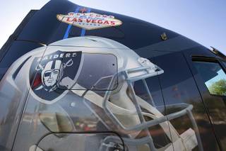 A truck decorated with a Raiders helmet and 