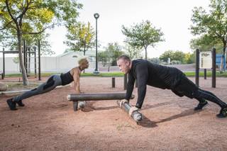 Kasper Jorgensen, right, and girlfriend Camille Alayne demonstrate some strength training outdoor exercises at Bruce Trent Park, Monday, Oct. 17, 2016. Both Jorgensen and Alayne, who are 40 and 41 years old, were overweight and reclaimed their health in their late thirties.