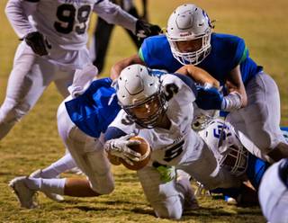 Foothill's Issac Oliva (5) extends for a touchdown versus the Green Valley defense on a run up the middle on Thursday, Oct. 27, 2016.
