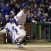 Chicago Cubs' Kris Bryant watches his home run during the fourth inning of Game 5 of the World Series against the Cleveland Indians Sunday, Oct. 30, 2016, in Chicago.

