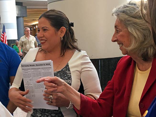 Aura Hernandez, 41, is shown with Rep. Dina Titus after she cast her first vote as a U.S. citizen at Boulevard mall in Las Vegas on Nov. 3, 2016.