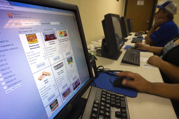 Food items are displayed on a screen at Lutheran Social Services of Nevada (LSSN) Monday, Nov. 7, 2016. LSSN has installed DigiMart software, an online food pantry system.
