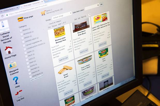 Food items are displayed on a screen at Lutheran Social Services of Nevada (LSSN) Monday, Nov. 7, 2016. LSSN has installed DigiMart software, an online food pantry system.