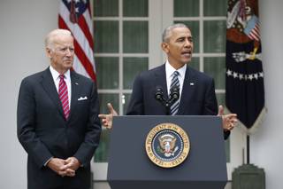 President Barack Obama, accompanied by Vice President Joe Biden, speaks in the election, Wednesday, Nov. 9, 2016, in the Rose Garden of the White House in Washington. (AP Photo/Pablo Martinez Monsivais)