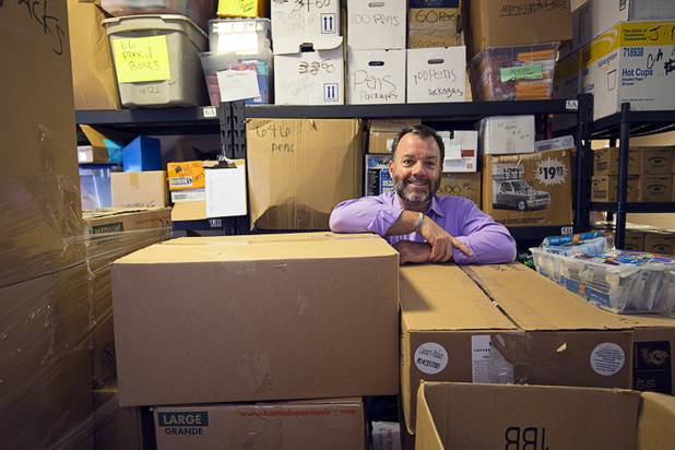 Patrick Spargur, co-founder of Project 150, poses in among boxes of donated school supplies in the Brady Caipa Volunteer & Distribution Center Thursday, Nov. 10, 2016. Project 150 is a nonprofit organization created to help homeless, displaced and disadvantaged High School students, Spargur said.