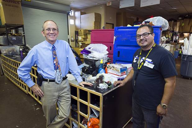 Volunteer Dave Levesque, left, and driver Fernando Anguiano pose in the Brady Caipa Volunteer & Distribution Center at Project 150 Thursday, Nov. 10, 2016. Project 150 was created to help homeless, displaced and disadvantaged High School students.