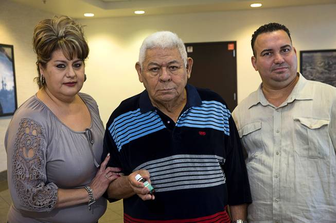 Cesar Ibarra poses with his daughter Veronica Fernandez and her husband Esteban Fernandez outside his doctor's office in Henderson Monday, Nov. 14, 2016. Ibarra was diagnosed with cancer and chose not to go through chemo, but instead started taking scorpion venom, a cancer treatment used in Cuba.