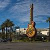 The Hard Rock Cafe, with its iconic guitar sign, at the corner of Paradise Road and Harmon Avenue in Las Vegas.