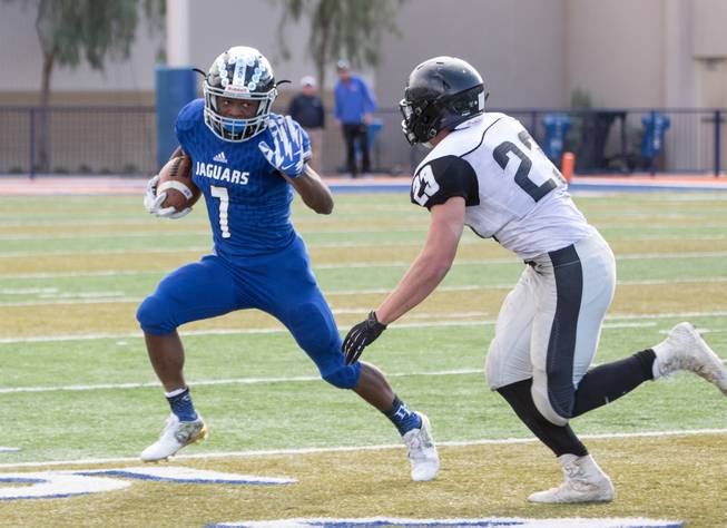 Desert Pines' running back, Isaiah Morris (7) carries the ball during the 3A high school football championship game, Saturday, Nov. 19, 2016 in Las Vegas, NV.