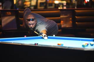 Chad Barber of Phoenix lines up a shot at Griff's, 3650 S. Decatur Blvd., Sunday, Nov. 20, 2016. Barber came to Las Vegas to compete at a tournament at Griff's, he said. The 8,000 sq. ft. pool room and bar (formerly known as Pool Sharks) is smoke free.