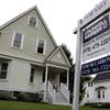 This Tuesday, May 24, 2016, file photo shows a home for sale in Andover, Mass. On Tuesday, Nov. 22, 2016, the National Association of Realtors reports on October sales of existing homes.