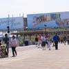 This July 3, 2015 photo shows pedestrians strolling on the Atlantic City Boardwalk. On Monday Nov. 28, 2016, Moody's Investors Service said the state of New Jersey's takeover of Atlantic City's assets and major decision-making power should prevent the struggling resort from defaulting on its debt at least through the end of 2017. 