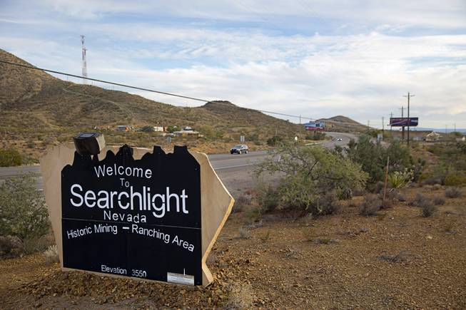 A monument sign welcomes travelers to Searchlight, Nev. Thursday, Dec. 1, 2016.
