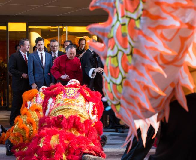 Chinese lions and a dragon perform a ceremony at the entrance of the Lucky Dragon during its grand opening Saturday, Dec. 3, 2016. 